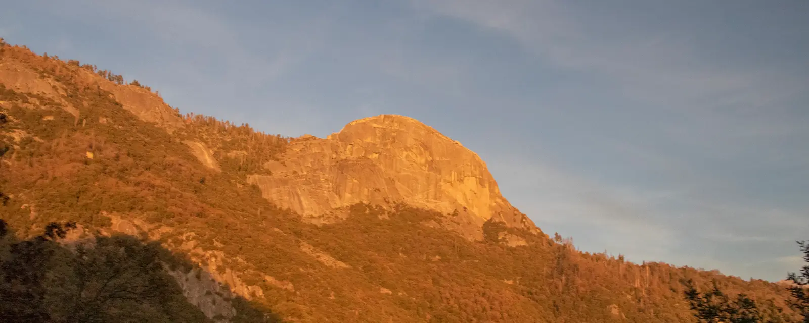 The setting sun lights the granite surface of Moro Rock in Sequoia & Kings Canyon National Parks.