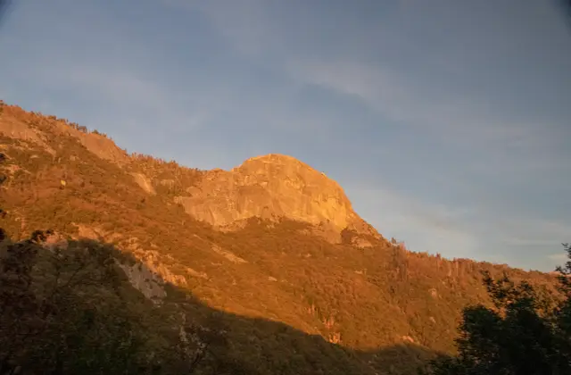 The setting sun lights the granite surface of Moro Rock in Sequoia & Kings Canyon National Parks.